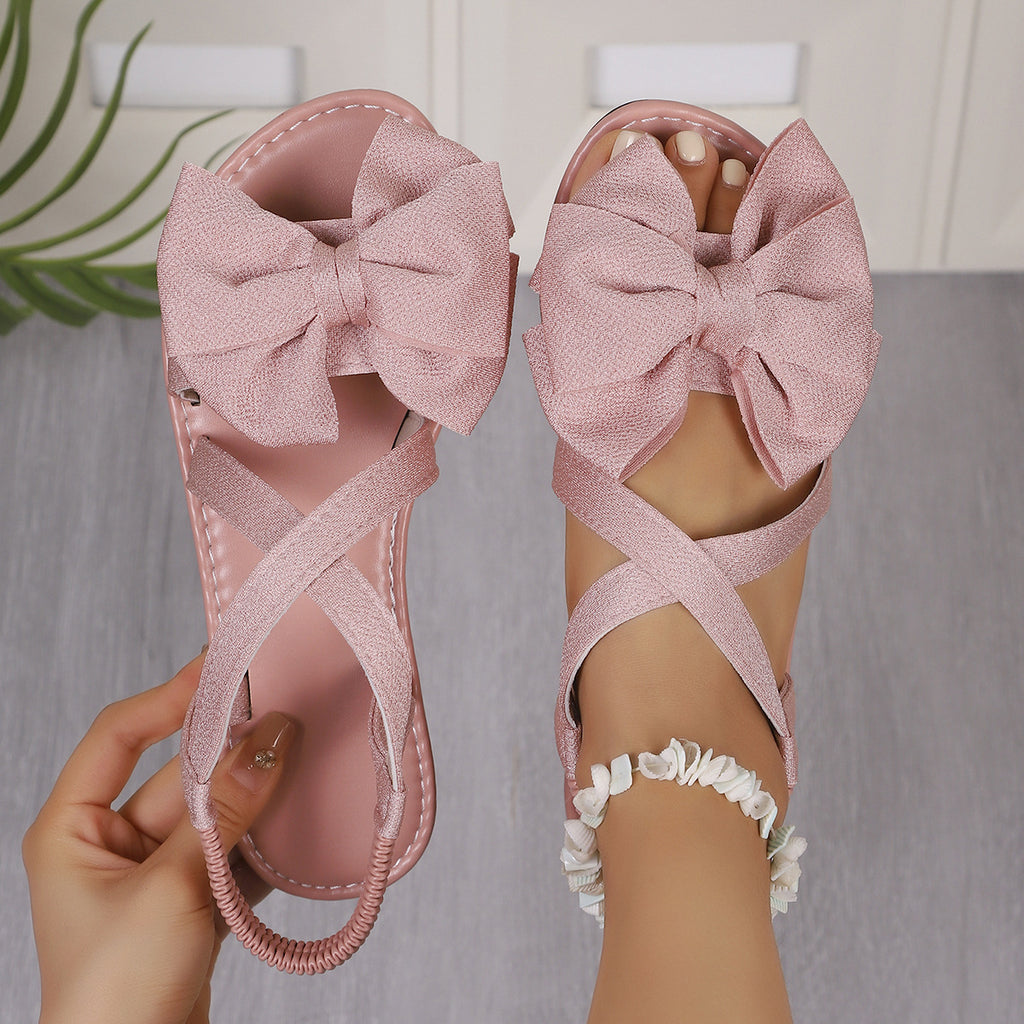 Flache Sandalen mit Schleifen